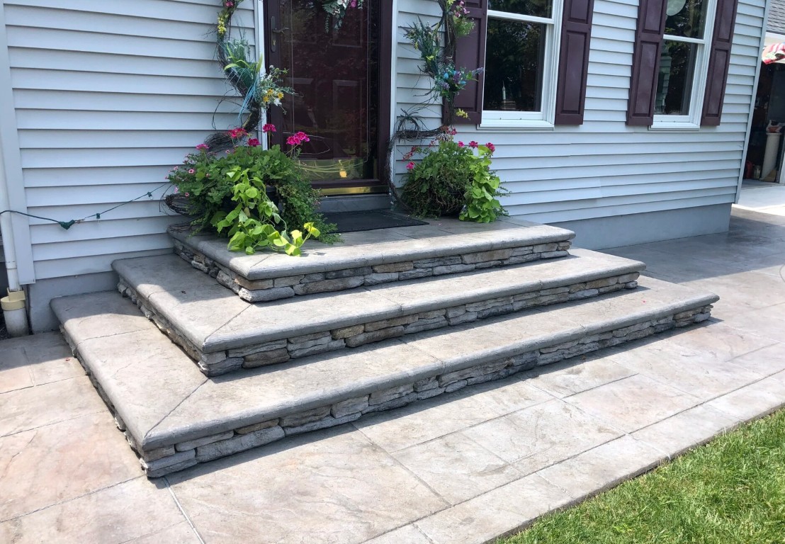 Decorative stamped concrete steps with stone texture at a home in Tacoma, WA